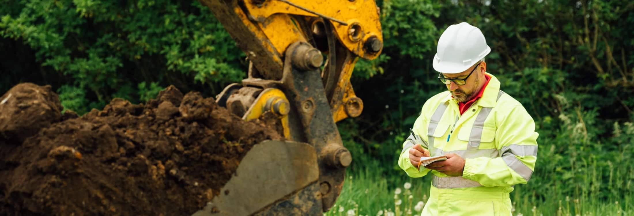 Aitken Labs engineer carrying out geotechnical testing and recording test data onsite in Scotland.