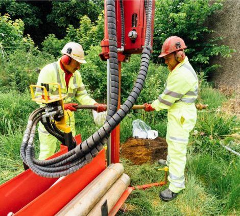 Aitken Labs engineers operating ground investigation drilling equipment onsite.